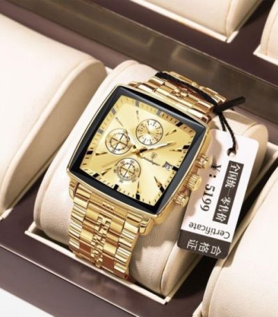 A POEDAGAR 866 luxury golden wristwatch with a square face and metal bracelet, resting on a display cushion.