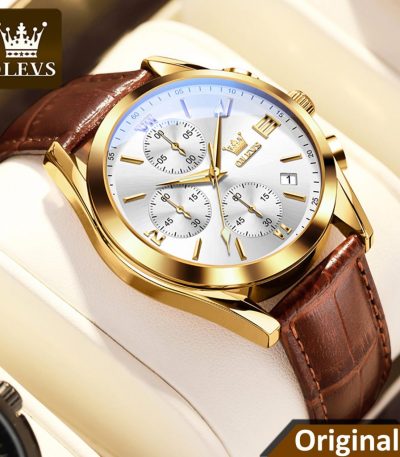 A close-up of the Olevs 5910 watch, featuring a gold case, white chronograph dial, and a brown textured leather strap.