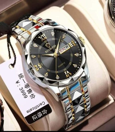 BINBOND 2521 Original Men’s Luxury Watch with black dial, silver and gold-tone band, and date display on a cream background