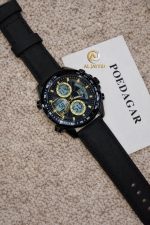 A POEDAGAR E108 analog-digital chronograph watch with a black strap and gold details, resting on a textured beige surface.