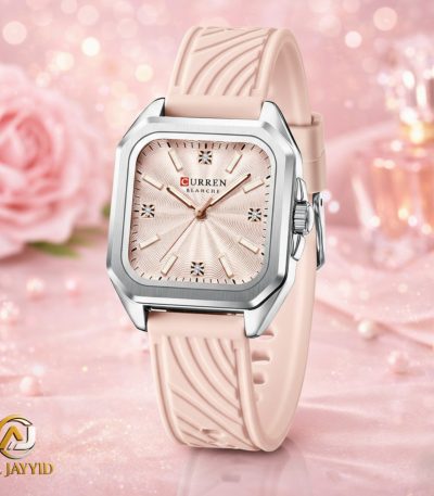 A Curren 9113 women's watch with a pink silicone strap and a square silver case. The watch face is also pink with a textured pattern.