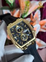 A close-up of the CURREN 8488 Men's Square Chronograph Watch with a gold case, black dial, and black silicone strap.