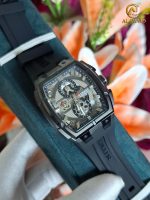 A CURREN 8488 Square Chronograph Men's Watch with a black case and silicone strap is held in a presentation box.