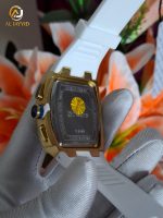 Close-up of the stainless steel back of a CURREN 8488 men's watch with a gold case and white strap held in a gloved hand.