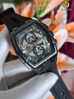 A person wearing a white glove holds the CURREN 8488 Square Chronograph Men's Watch, showing its black case and silver dial.