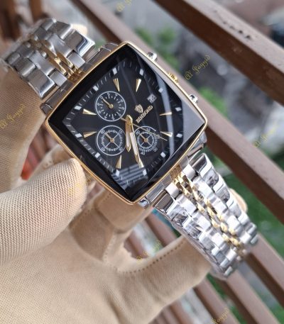 A gloved hand holding a Binbond 911 Original Men’s Luxury Watch, showing its square black face and two-tone silver and gold bracelet.