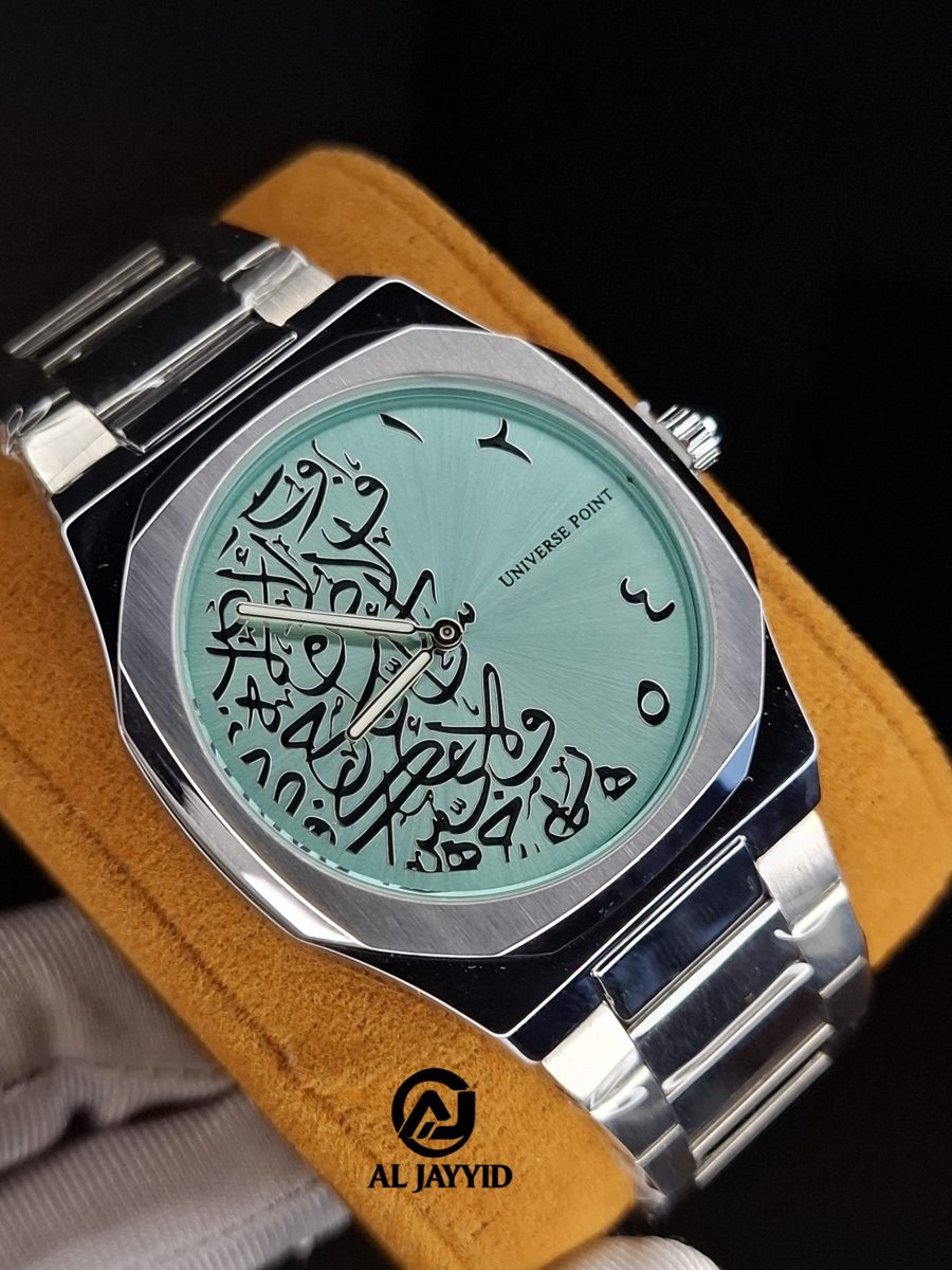A close-up of the Universe Point Arabic calligraphy watch, featuring a tiffain colored dial and a silver metal band.