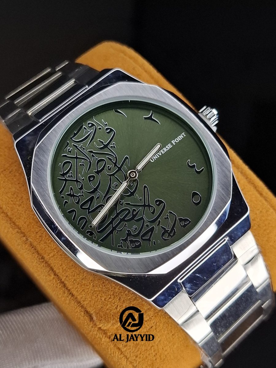 A Universe Point Arabic calligraphy watch with an olive green dial and a silver-colored stainless steel case and link bracelet.