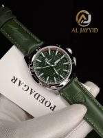 A gloved hand holding a POEDAGAR 895 men's watch with a silver case, textured green dial, and a matching green leather strap.
