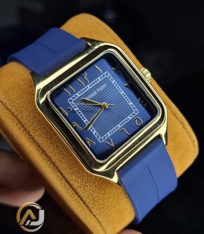 A Universe Point watch with a square gold case, a dark blue dial with Arabic numerals, and a blue silicone strap, shown angled.