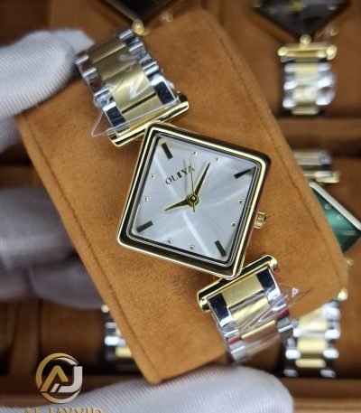 A close-up of the OLIYA 6819 women's two-tone watch, showing its square gold case and silver and gold metal bracelet.