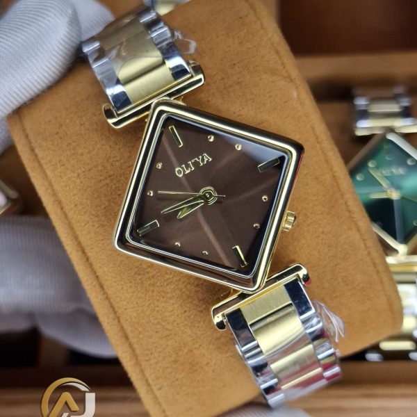 A gloved hand holding the OLIYA 6819 Women's Two-Tone Watch, showing its square brown dial and gold and silver bracelet.