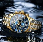 A BINBOND 7741 waterproof watch featuring a two-tone gold and silver metal bracelet and a starry blue chronograph dial.