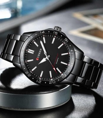 A black Curren 8452 quartz watch with a matching black metal link bracelet, angled on a display stand.