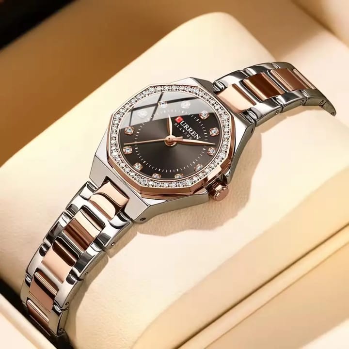 A CURREN 9100 women's luxury quartz watch featuring a two-tone rose gold and silver bracelet and a dark dial with crystals.