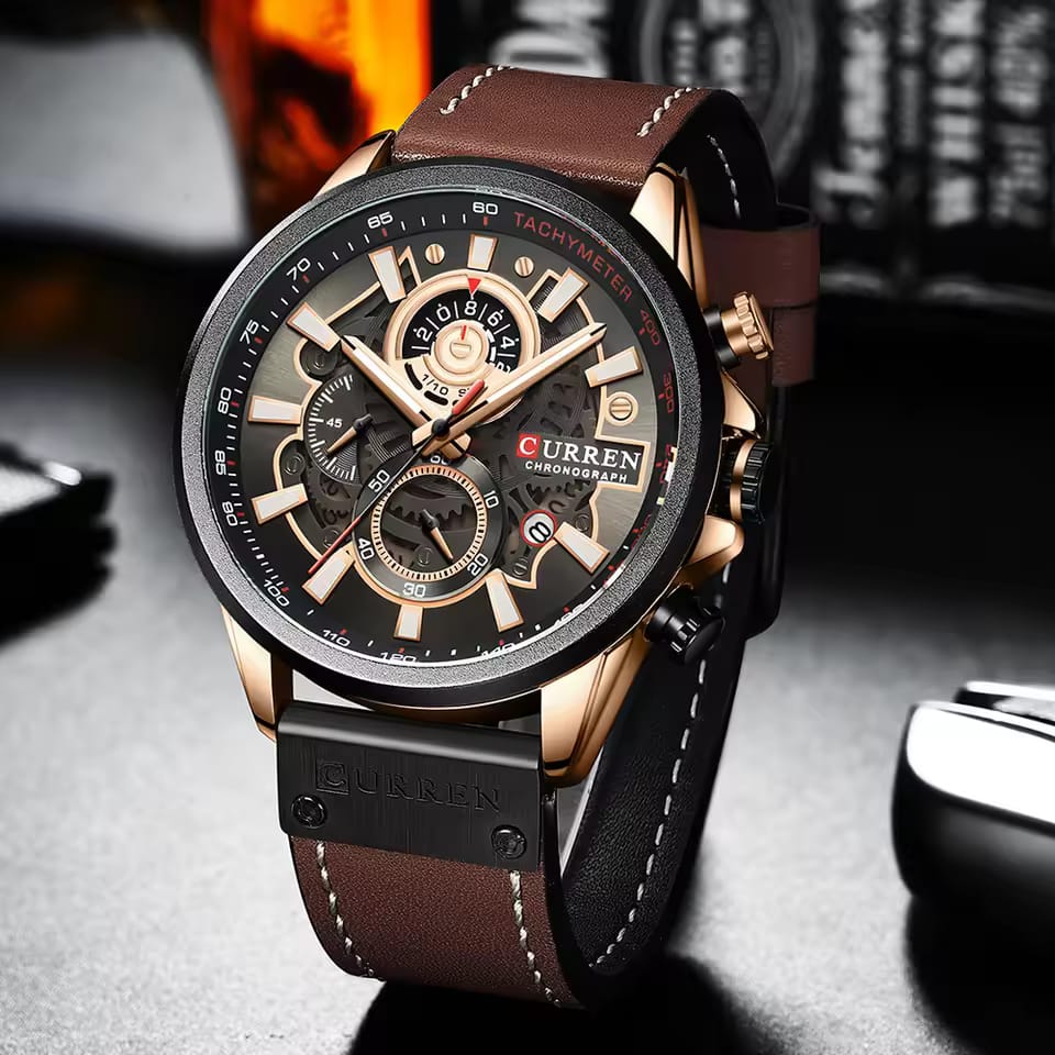 A close-up view of the CURREN 8380 chronograph men's watch, showing its brown leather strap and rose gold case.