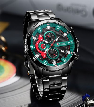 A close-up of the Curren 8402 watch in black, featuring its distinctive green and red detailed chronograph dial.