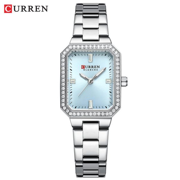 A CURREN 9102 silver stainless steel women's watch with a light blue rectangular face surrounded by small crystals.