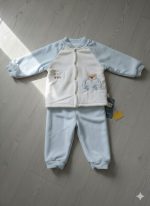 Baby cartoon velvet thermal base layer set in light blue and white, with a bear and car embroidery, laid flat on a floor.