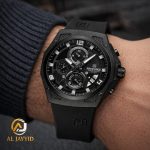 A man wearing the Naviforce 8051T Black Silicone Chronograph watch with a black dial and textured black case.