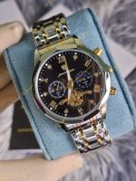 A Poedagar 938 men's chronograph watch with a black dial, gold details, and a two-tone stainless steel bracelet.