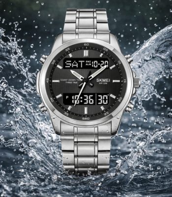 Front view of the SKMEI 2049 Men's Analog-Digital Watch in silver, with its dark face and steel bracelet amidst splashing water.