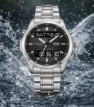 Front view of the SKMEI 2049 Men's Analog-Digital Watch in silver, with its dark face and steel bracelet amidst splashing water.