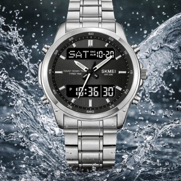 Front view of the SKMEI 2049 Men's Analog-Digital Watch in silver, with its dark face and steel bracelet amidst splashing water.