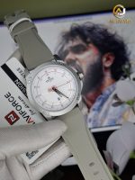 A gloved hand holding the NAVIFORCE 8031 men's gray quartz watch, showing its white dial and gray silicone strap.