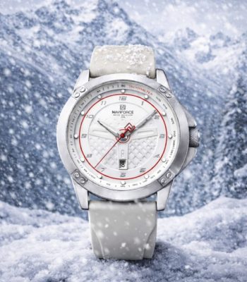 A NAVIFORCE 8031 men's gray quartz watch with a white dial and red accents, shown resting in a snowy mountain landscape.