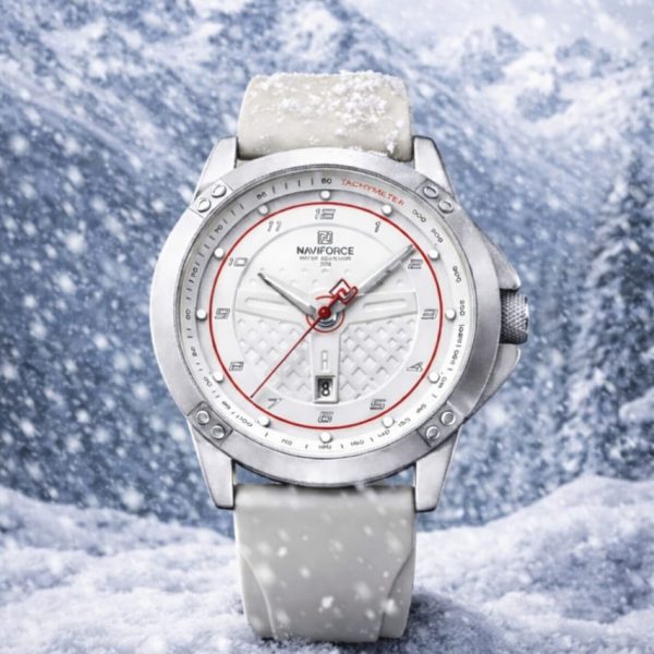 A NAVIFORCE 8031 men's gray quartz watch with a white dial and red accents, shown resting in a snowy mountain landscape.