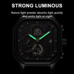 A close-up of the POEDAGAR 628 Men's Belt Watch with its luminous hour and minute hands glowing bright green in the dark.