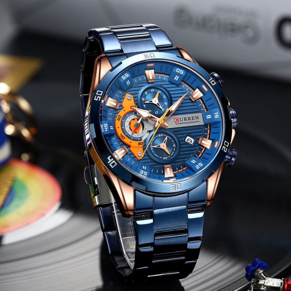 A front-angle view of the Curren 8402 Blue Watch, featuring a blue dial with orange accents and a two-tone blue and rose gold case.