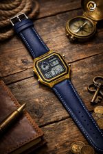 A Casio AE-1200WHL-5AV men's watch with a gold-colored case and a blue leather strap, placed on a rustic wooden table.
