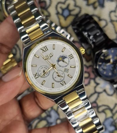 A close-up, top-down shot of a gold-toned LIGE luxury chronograph watch being held by a hand