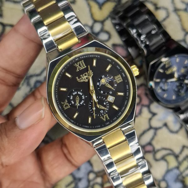 A close-up, top-down shot of a gold-toned LIGE luxury chronograph watch being held by a hand