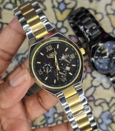 A close-up, top-down shot of a gold-toned LIGE luxury chronograph watch being held by a hand