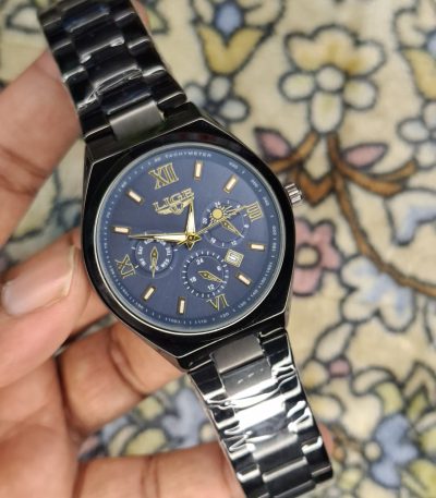 A close-up, top-down shot of a gold-toned LIGE luxury chronograph watch being held by a hand
