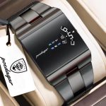 A black Poedagar 857 men's wristwatch with a rectangular case and a unique rotating dial display, resting on a white cushion inside a watch box.