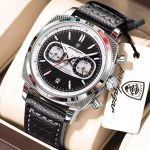A silver Poedagar 838 luxury sports chronograph watch with a forest green dial and a matching textured green leather strap, displayed in a branded box. The watch features three sub-dials, a date window, and a silver tachymeter bezel.